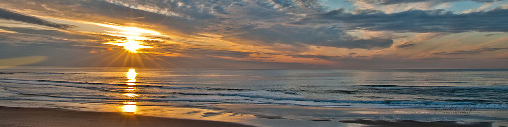 Stunning sunset over ocean at Cannon Beach